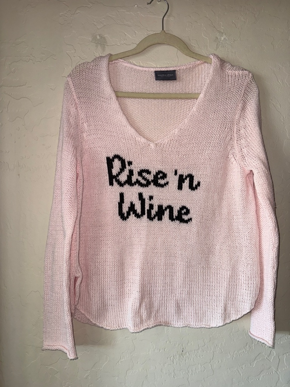 Wooden Ships features a playful "Rise 'n Wine" graphic pink v neck sweater s/m